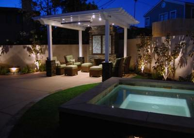 Kingstons outdoor living space: spa, outdoor living room, and fireplace