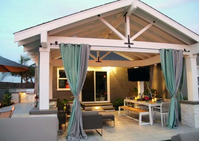 Outdoor living area with mounted television